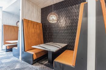 A booth in a restaurant with two benches and a table